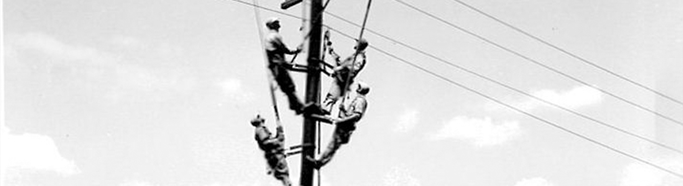 4 Lineman on a pole black and white